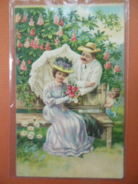 Image for Couple in Garden Hiding Cupid Postcard