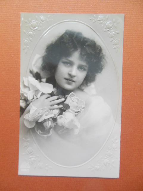 Image for Real Photo Postcard Pretty Girl Clutching Roses Postales Antiguas
