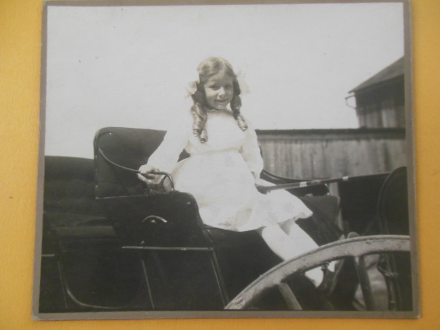 Image for Photograph Little Girl In Sunday Best In A Buggy (Early 1990's)